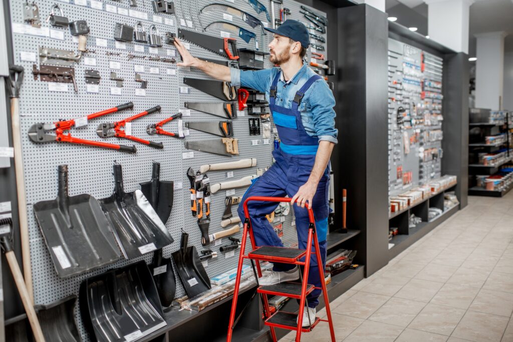 Worker in the shop with building tools
